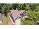 Aerial view of a well-maintained home highlighting the roof, landscaping, and surrounding greenery at 7218 Jacobs Fork Ln, Charlotte, NC 28273