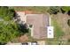 Aerial view of home showing shingled roof, manicured landscaping, driveway, and proximity to mature trees at 7218 Jacobs Fork Ln, Charlotte, NC 28273