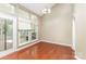 Well-lit dining area featuring large windows and access to outdoor space at 7218 Jacobs Fork Ln, Charlotte, NC 28273