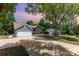 Charming home exterior featuring a well-manicured front yard, two car garage, and inviting entrance at 7218 Jacobs Fork Ln, Charlotte, NC 28273