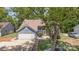 Two-story home featuring a well-manicured lawn and mature trees in a residential neighborhood at 7218 Jacobs Fork Ln, Charlotte, NC 28273