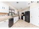 The bright kitchen offers white cabinets, granite countertops, and modern appliances at 7218 Jacobs Fork Ln, Charlotte, NC 28273
