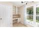 Bright office nook includes desk area, built-in shelves, and natural light at 7218 Jacobs Fork Ln, Charlotte, NC 28273