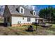 Large backyard featuring an outdoor kitchen with a grill and a dining area at 7648 Forest Oak Dr, Denver, NC 28037