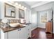 Bright bathroom features a bowl sink, granite counters, modern mirrors, and natural light from a window at 7648 Forest Oak Dr, Denver, NC 28037