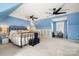 Spacious bedroom featuring carpeted floors and a dedicated workspace at 7648 Forest Oak Dr, Denver, NC 28037