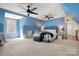 Expansive bedroom with pitched ceilings, carpeted floors, and ample natural light at 7648 Forest Oak Dr, Denver, NC 28037