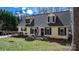 Charming two-story home with a welcoming front porch and a cozy deck, surrounded by lush greenery at 7648 Forest Oak Dr, Denver, NC 28037