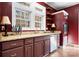 Bright kitchen featuring granite countertops, modern appliances, and wooden shelving at 7648 Forest Oak Dr, Denver, NC 28037