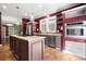 Open kitchen showcasing a granite-topped island, stainless steel appliances, and stylish pendant lighting at 7648 Forest Oak Dr, Denver, NC 28037