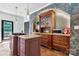 Kitchen featuring a stone accent wall, granite countertops, stainless appliances, and gas stovetop at 7648 Forest Oak Dr, Denver, NC 28037