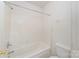 Clean white bathroom with modern fixtures and a shower-tub combo at 8414 Oak Ne Dr, Charlotte, NC 28269