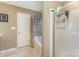 Bathroom featuring a shower/tub combo with sliding glass doors and linen closet at 8414 Oak Ne Dr, Charlotte, NC 28269