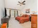 Spacious bedroom with vaulted ceiling, bay window, and neutral carpet at 8414 Oak Ne Dr, Charlotte, NC 28269