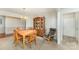 Traditional dining room offering a wooden table with chairs, display cabinet, and classic chandelier at 8414 Oak Ne Dr, Charlotte, NC 28269