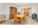 Traditional dining room featuring wood table and chairs, vintage hutch, chandelier, and access to small kitchen area at 8414 Oak Ne Dr, Charlotte, NC 28269