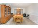 Formal dining room boasting a wooden table with chairs, a china cabinet, and a classic chandelier at 8414 Oak Ne Dr, Charlotte, NC 28269