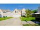 Charming two-story home with a well-manicured lawn and an attached two-car garage at 8414 Oak Ne Dr, Charlotte, NC 28269