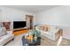 Cozy living room providing comfortable seating, neutral walls, and natural light at 8414 Oak Ne Dr, Charlotte, NC 28269