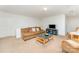 Cozy living area with a brown sofa, coffee table, and entertainment center at 8414 Oak Ne Dr, Charlotte, NC 28269