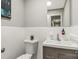 Clean half-bathroom offers a simple vanity with modern faucet and a mounted mirror at 981 Sherwood Cir, Lancaster, SC 29720