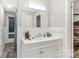 Bright bathroom features tiled shower and walls, and an updated vanity with storage at 981 Sherwood Cir, Lancaster, SC 29720