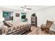 Cozy bedroom features wood-look flooring, a rustic rocking chair, and natural light at 981 Sherwood Cir, Lancaster, SC 29720