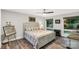 Charming bedroom featuring hardwood floors and a lovely patchwork quilt on the bed at 981 Sherwood Cir, Lancaster, SC 29720