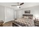 Comfortable bedroom showcases hardwood floors, ceiling fan, and a decorative wall painting at 981 Sherwood Cir, Lancaster, SC 29720