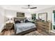 Comfortable bedroom with a queen-sized bed, hardwood floors, and natural light at 981 Sherwood Cir, Lancaster, SC 29720