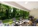 Back deck with patio furniture, grill, and overlooking the backyard and trees at 981 Sherwood Cir, Lancaster, SC 29720