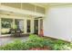 Inviting front porch with stone flooring, bench, and lush landscaping, leading to the front door at 981 Sherwood Cir, Lancaster, SC 29720