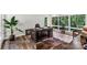 Well-appointed home office featuring hardwood floors, a large desk, and natural light from large windows at 981 Sherwood Cir, Lancaster, SC 29720