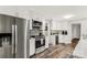 Modern kitchen with stainless steel appliances, stylish cabinets, and hardwood floors at 981 Sherwood Cir, Lancaster, SC 29720