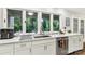 Bright kitchen featuring granite countertops, stainless steel appliances, and a scenic window view at 981 Sherwood Cir, Lancaster, SC 29720