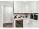 Kitchen counter area with built-in wine cooler and white cabinets at 981 Sherwood Cir, Lancaster, SC 29720
