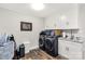 Bright laundry area features granite counters, modern appliances, and lots of storage at 981 Sherwood Cir, Lancaster, SC 29720
