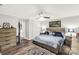 Spacious main bedroom featuring hardwood floors, ceiling fan, and ensuite bathroom at 981 Sherwood Cir, Lancaster, SC 29720