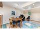 Finished basement featuring dining and workspace areas with unique tile flooring and ample lighting at 103 Sadler Rd, Mount Holly, NC 28120