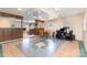 Finished basement area with unique tile flooring, dining space, and a functional workspace at 103 Sadler Rd, Mount Holly, NC 28120