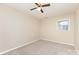 This bedroom has one window providing natural light and tan carpeting at 103 Sadler Rd, Mount Holly, NC 28120