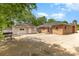 Garage and driveway of a brick home with green space at 103 Sadler Rd, Mount Holly, NC 28120