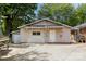 Exterior of detached one car garage with a side door at 103 Sadler Rd, Mount Holly, NC 28120