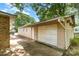 Exterior of detached one car garage with a side door at 103 Sadler Rd, Mount Holly, NC 28120