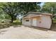 Exterior of detached one car garage with a side door at 103 Sadler Rd, Mount Holly, NC 28120