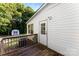 Home exterior with a deck, security camera, door and a glimpse of the backyard shed at 1055 Cedar Hill Dr, Rockwell, NC 28138