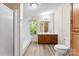 Bathroom features a modern shower, double sink vanity, and ample lighting at 1055 Cedar Hill Dr, Rockwell, NC 28138