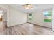Spacious bedroom with large windows providing natural light and wood-look flooring at 1055 Cedar Hill Dr, Rockwell, NC 28138