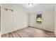 Bright bedroom with new flooring, a window view and neutral paint at 1055 Cedar Hill Dr, Rockwell, NC 28138