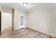Bedroom with new flooring, neutral paint, and exterior door access at 1055 Cedar Hill Dr, Rockwell, NC 28138